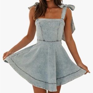 A blue denim dress with tie straps